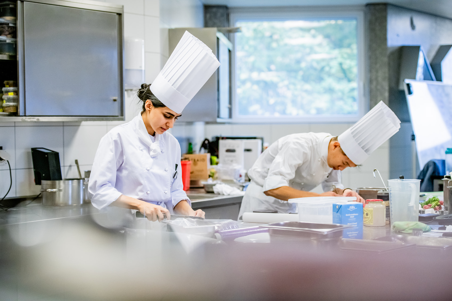 CAAS student Maitha Warshaw cooking in kitchen 